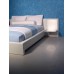 White Platform Bed with White Headboard and Aluminum Nightstands