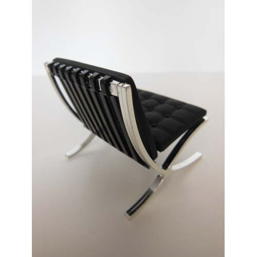 barcelona chair bond sitting on a barcelona chair right before m