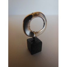 Silver Ring on Black Wood Base